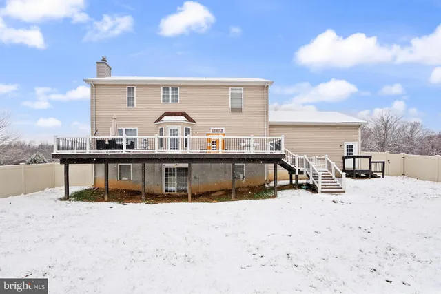 a view of a house with a snow on the road