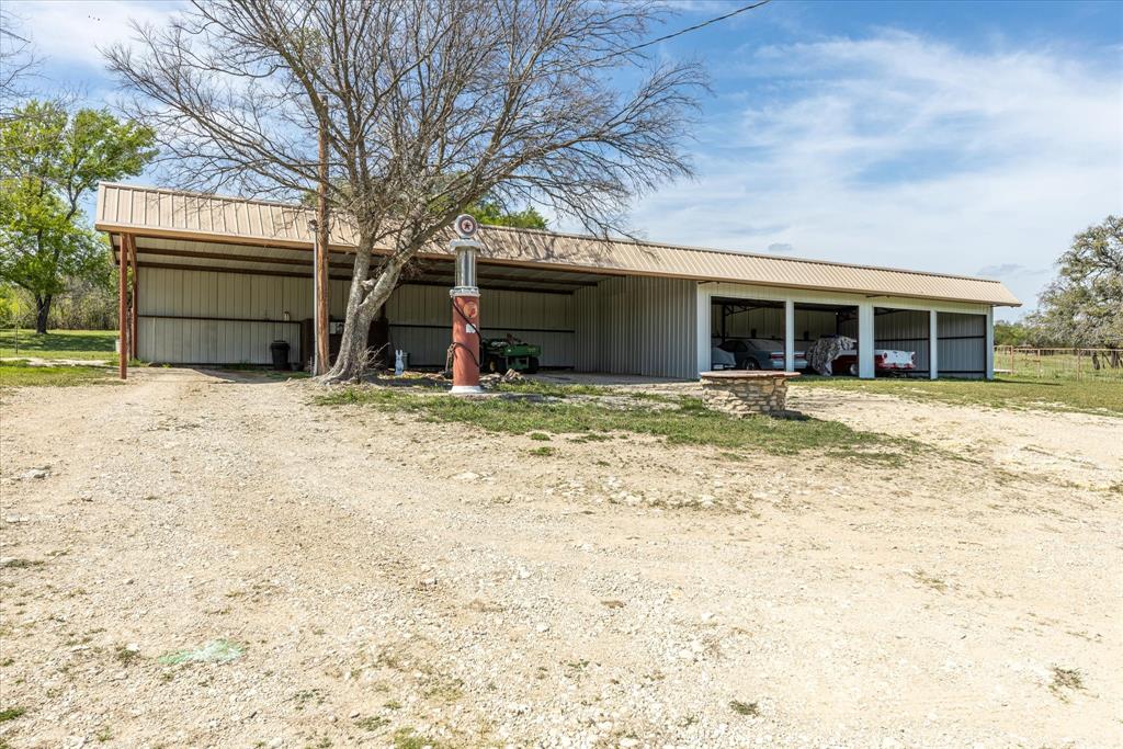 9885 County Road 270 Hico, TX 76457 - Photo 13 of 40 a view of a house with a yard covered in snow