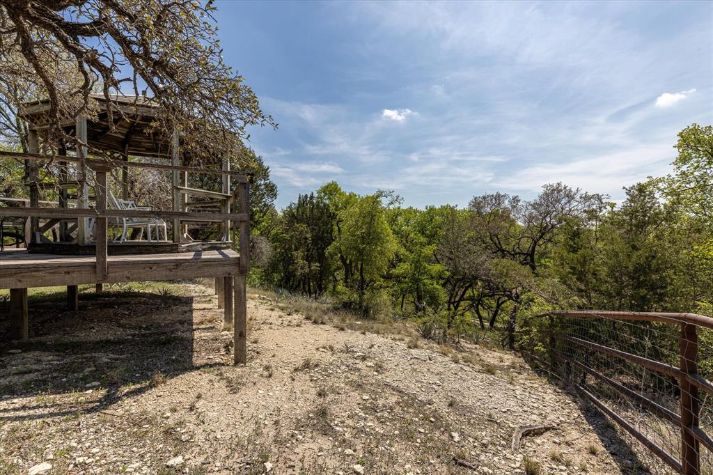9885 County Road 270 Hico, TX 76457 - Photo 16 of 40 a view of a pathway with a wrought fence