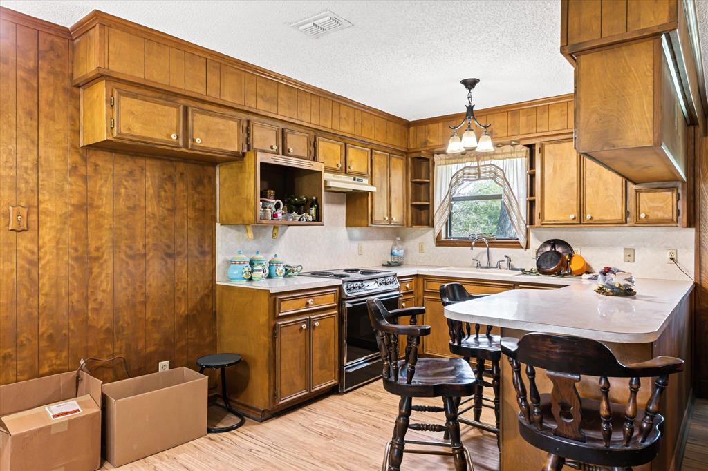 9885 County Road 270 Hico, TX 76457 - Photo 21 of 40 a kitchen with a sink appliances and cabinets