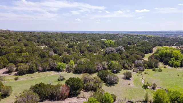 an aerial view of a houses with outdoor space