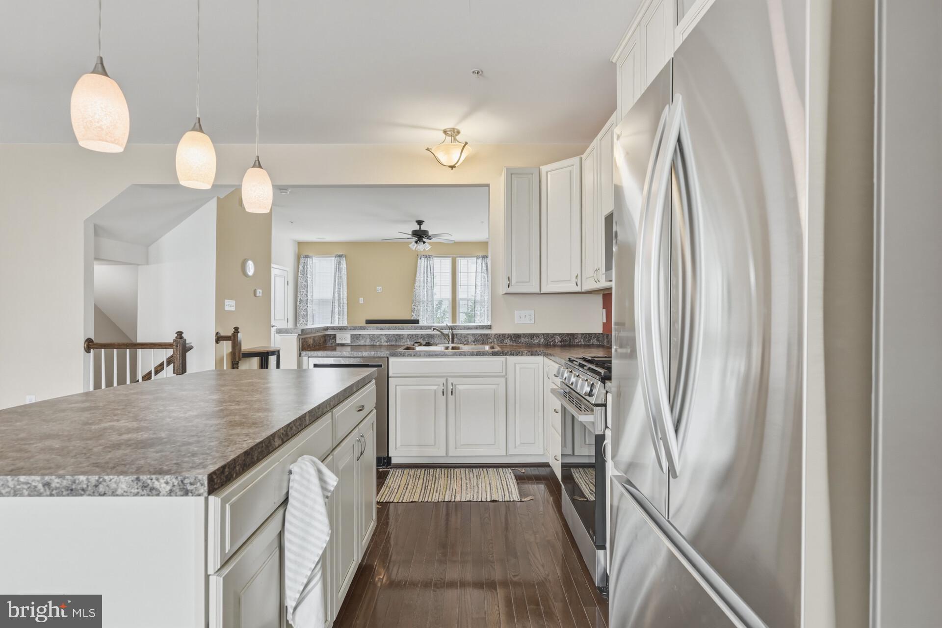 325 Schmidt Road Phoenixville, PA 19460 - Photo 16 of 27 a kitchen with stainless steel appliances granite countertop a sink stove and refrigerator