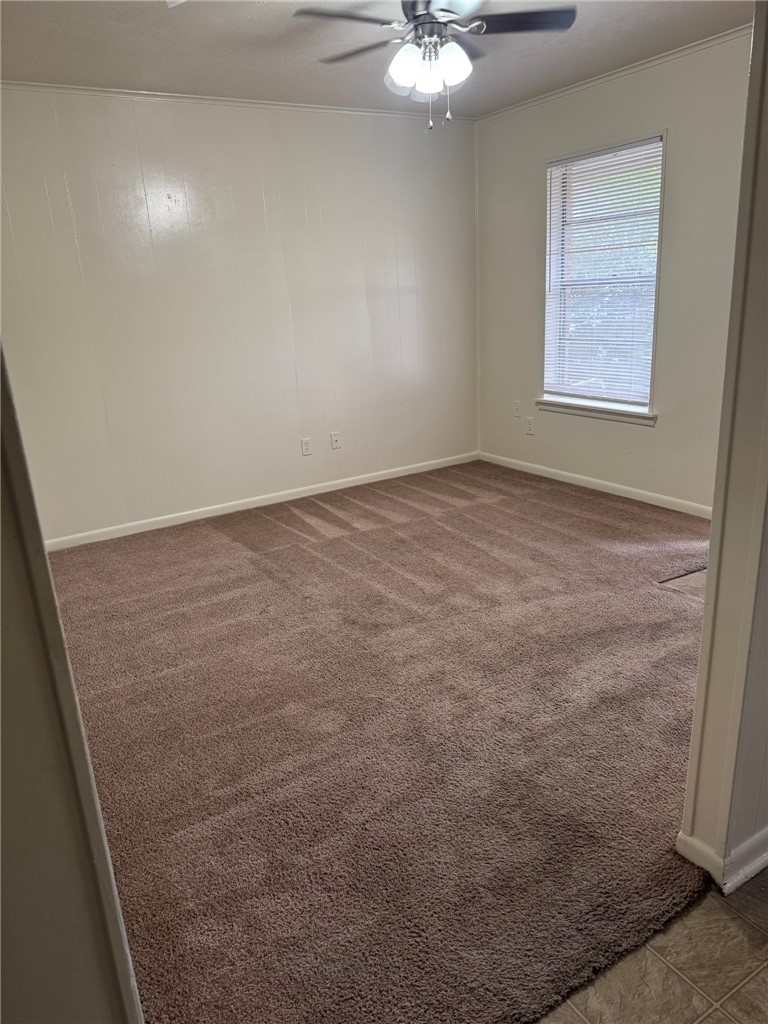 3180 Cain Road, Unit 158 College Station, TX 77845 - Photo 6 of 8 an empty room with a chandelier fan and windows