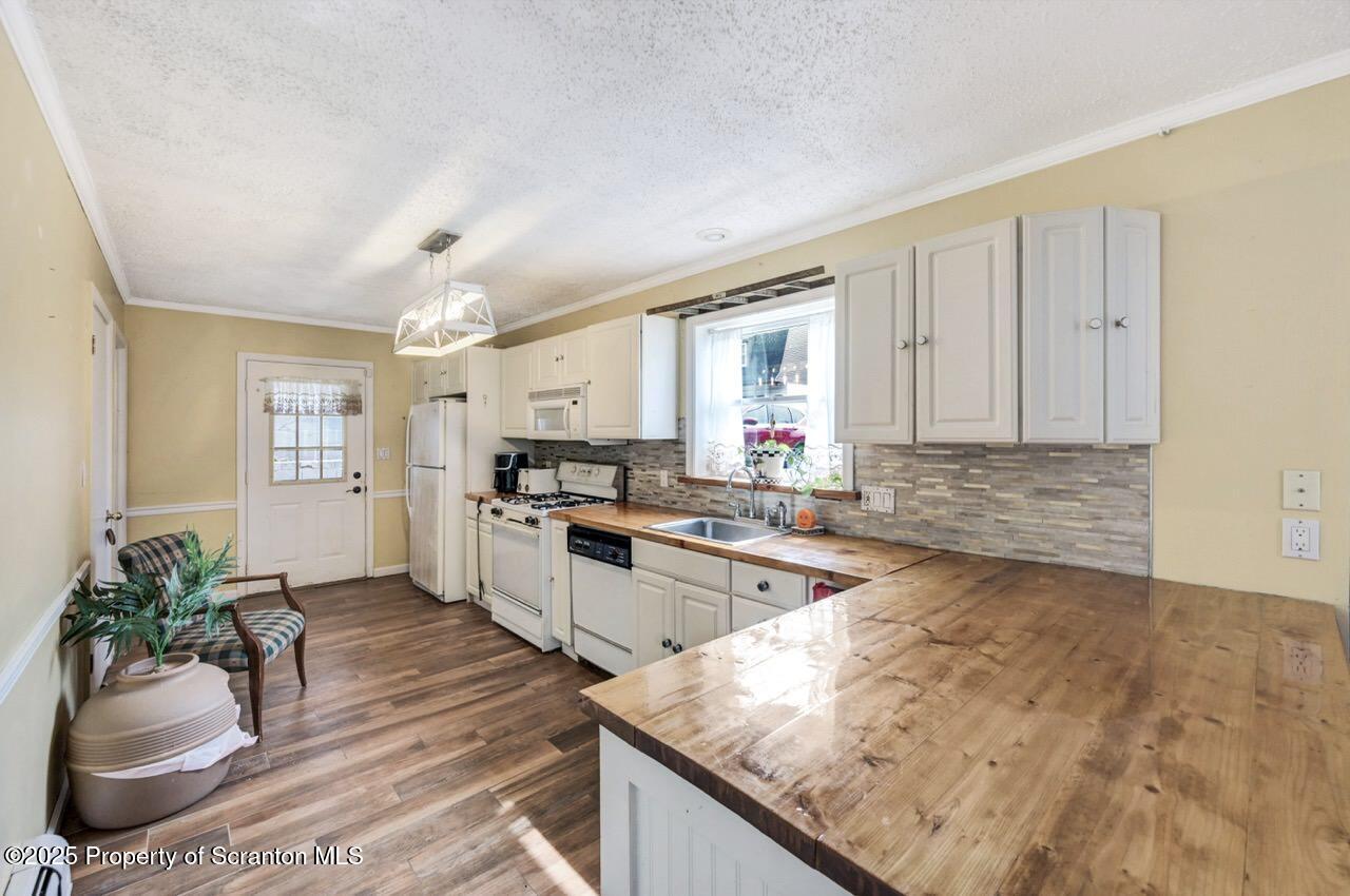 2035 Delaware Street Dunmore, PA 18512 - Photo 11 of 44 a kitchen with a stove a sink and a refrigerator
