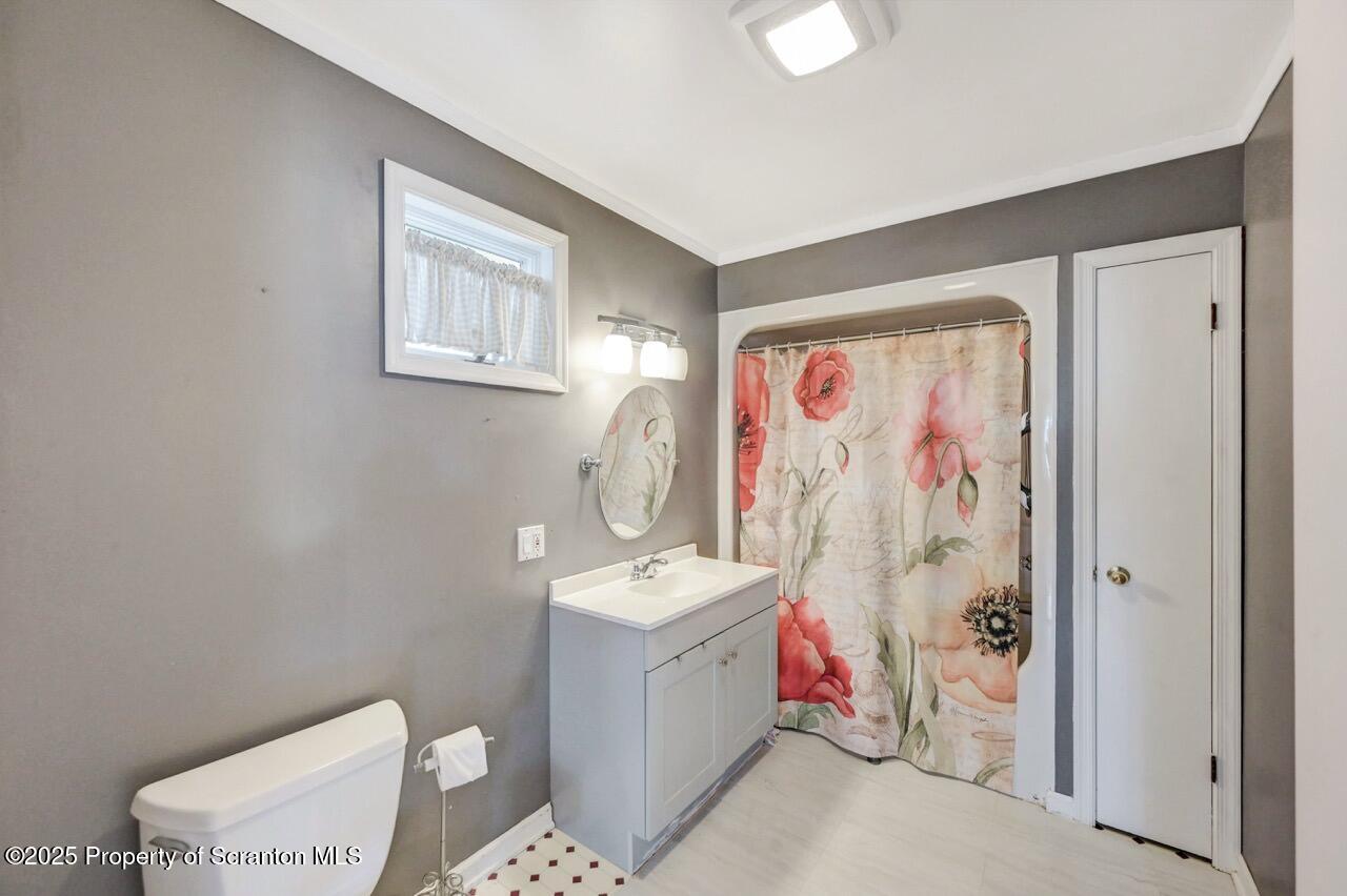 2035 Delaware Street Dunmore, PA 18512 - Photo 16 of 44 a bathroom with a sink toilet and shower