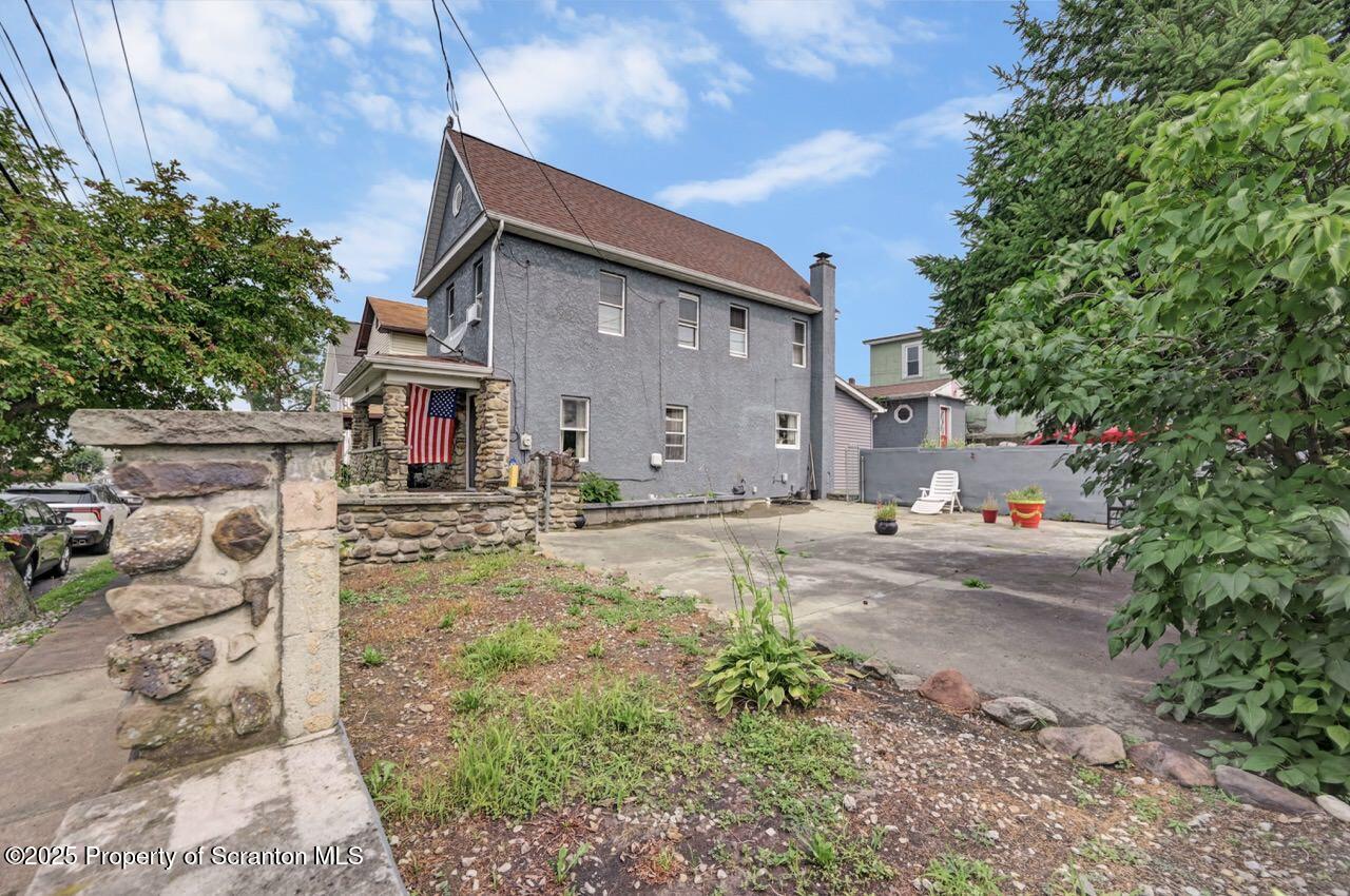 2035 Delaware Street Dunmore, PA 18512 - Photo 2 of 44 a front view of a house with garden