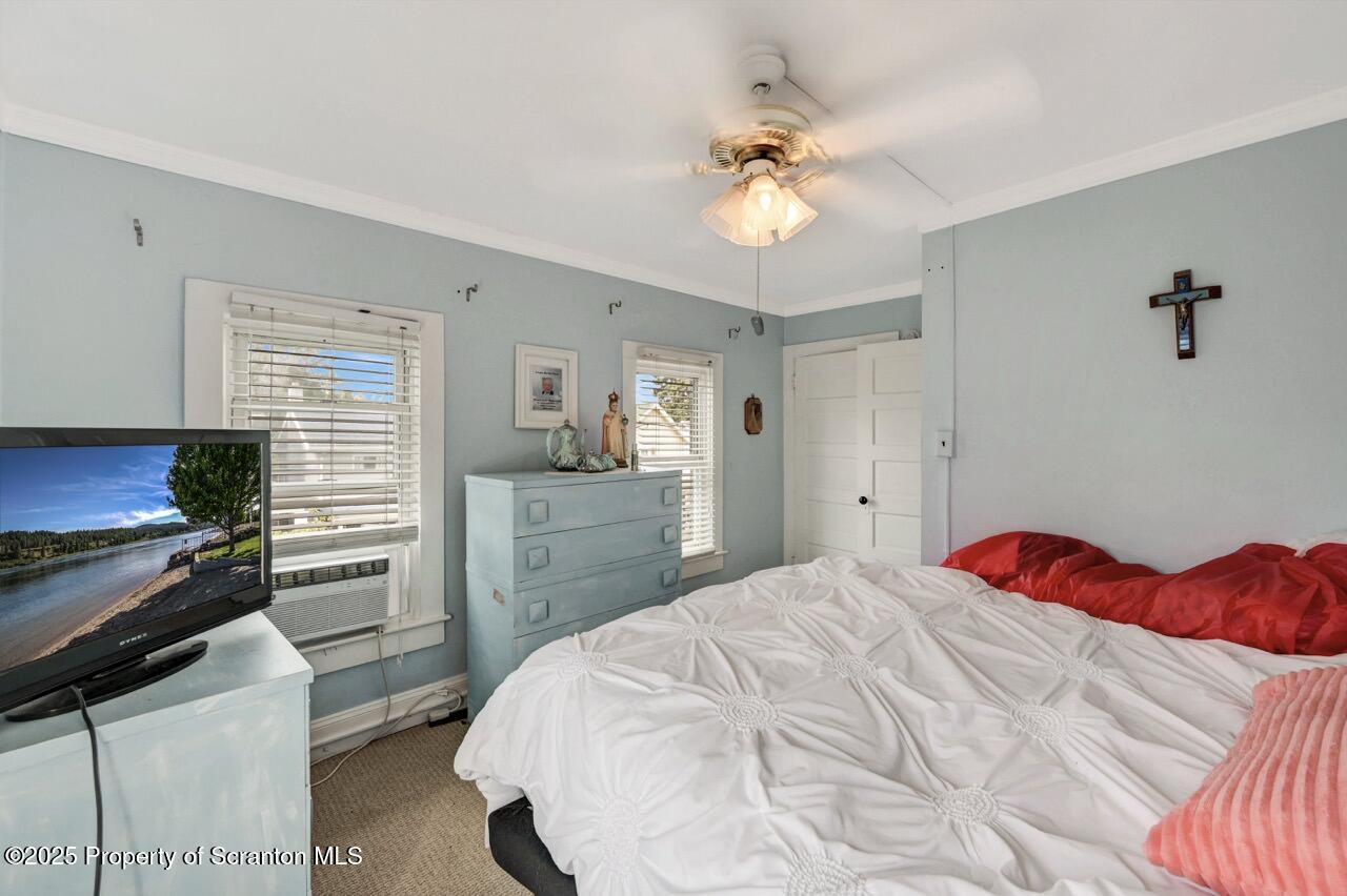 2035 Delaware Street Dunmore, PA 18512 - Photo 23 of 44 a bedroom with a bed and a chandelier