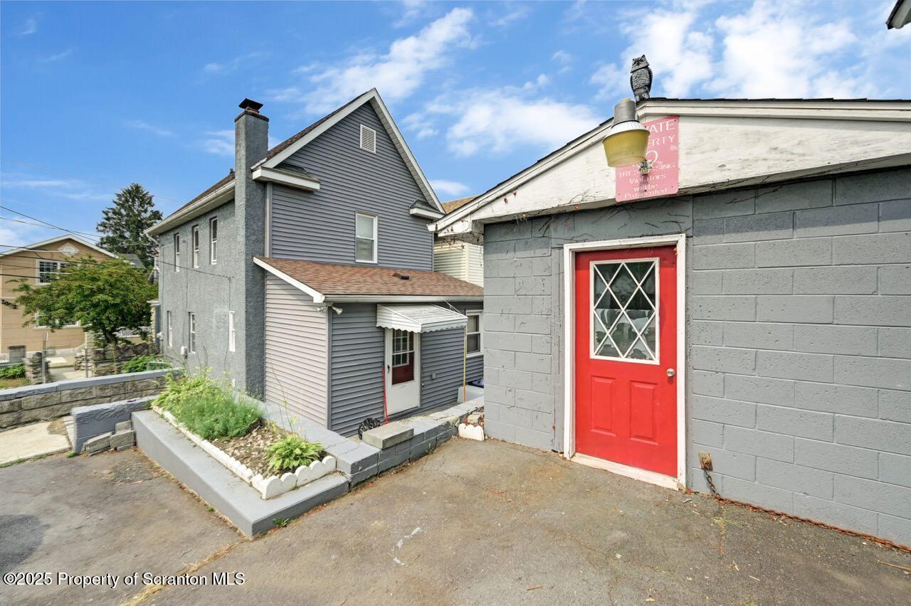 2035 Delaware Street Dunmore, PA 18512 - Photo 38 of 44 a front view of a house with a garden