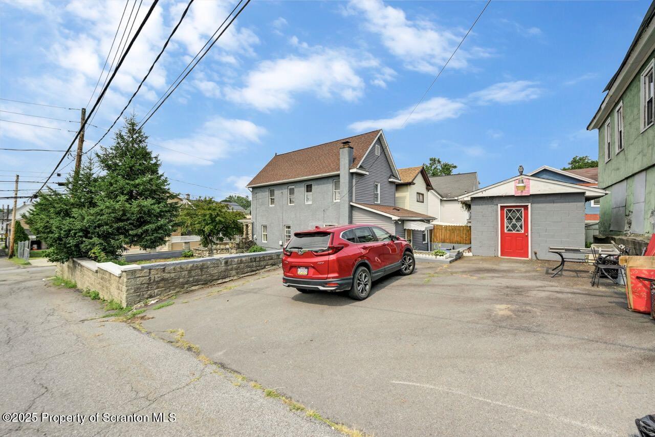 2035 Delaware Street Dunmore, PA 18512 - Photo 39 of 44 a front view of a house with garage