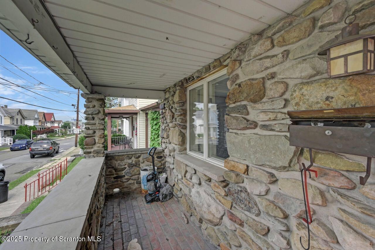 2035 Delaware Street Dunmore, PA 18512 - Photo 5 of 44 a view of a patio with table and chairs barbeque with wooden floor