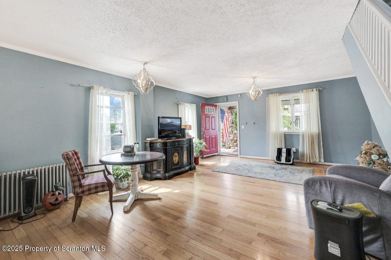 2035 Delaware Street Dunmore, PA 18512 - Photo 6 of 44 a living room with furniture a dining table and a window