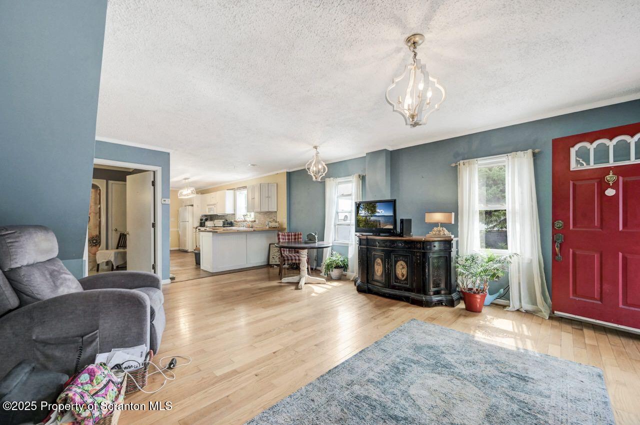 2035 Delaware Street Dunmore, PA 18512 - Photo 9 of 44 a living room with furniture and a fireplace