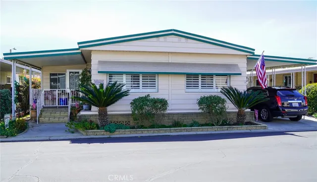 a front view of a house with a yard and a garage