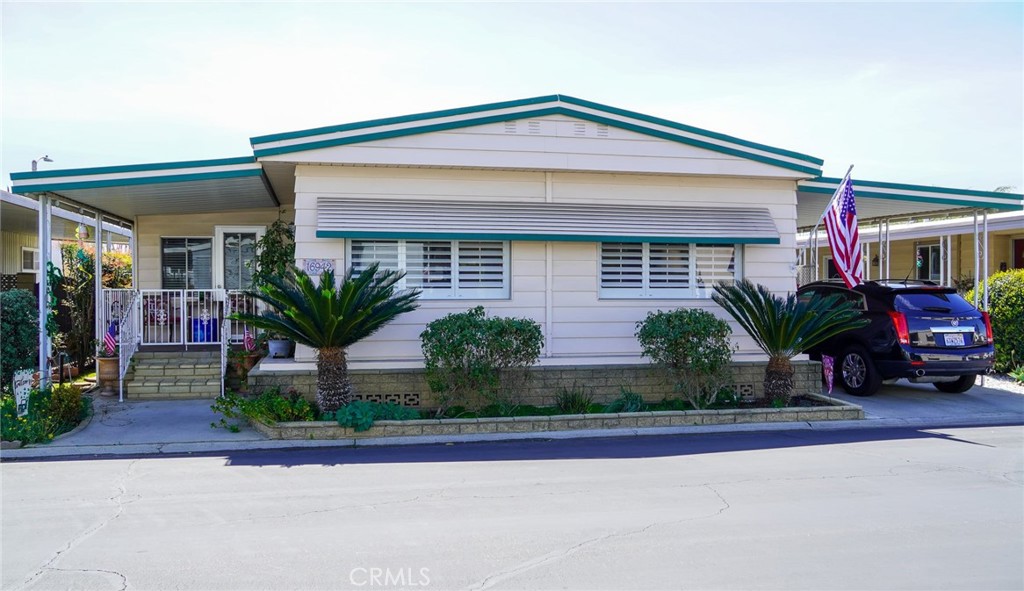 a front view of a house with a yard and a garage