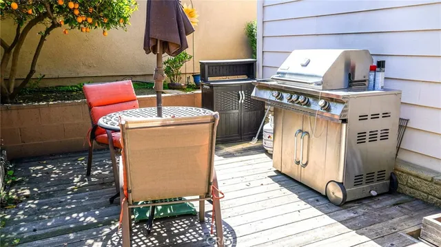 a view of a chairs with table in backyard