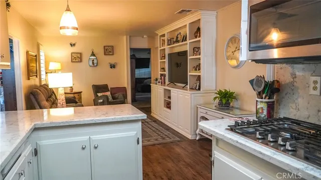 a kitchen with stainless steel appliances granite countertop a stove and a sink