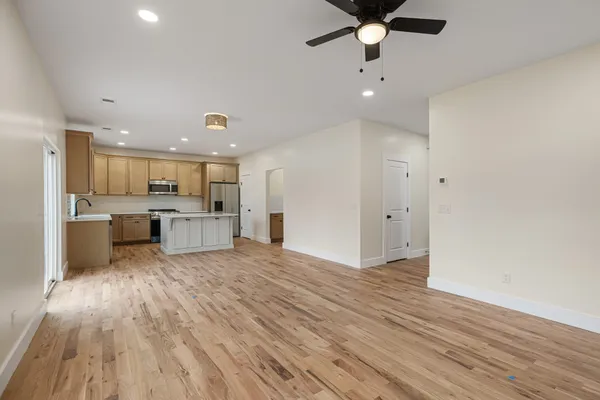a view of kitchen with wooden floor and window