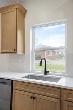 a bathroom with a sink and a window