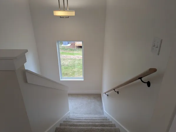 a view of a hallway with a window