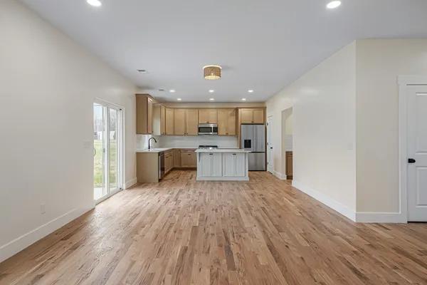 a view of kitchen with wooden floor