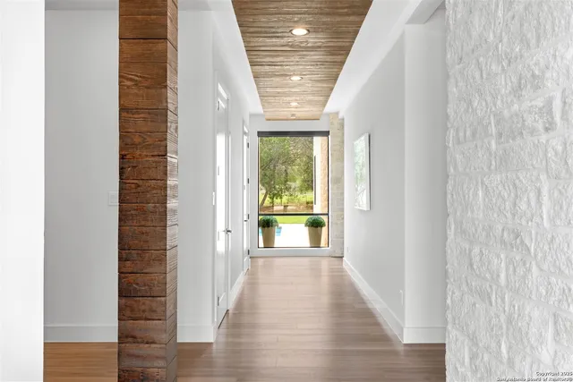 a view of an entryway with wooden floor