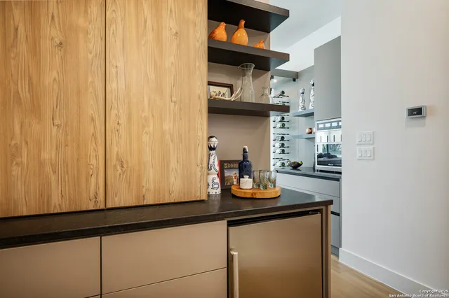 a kitchen with a sink and large window