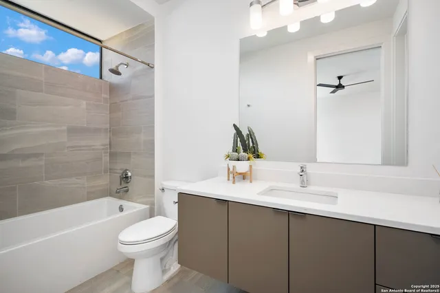 a view of a house with a yard and a garage