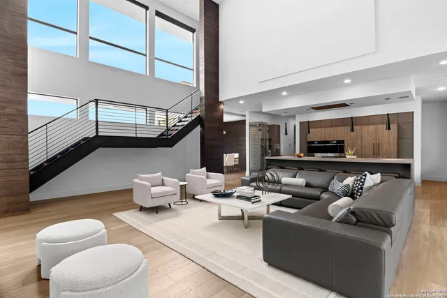 a living room with furniture and a lamp