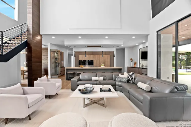 a living room with furniture or couch and a kitchen