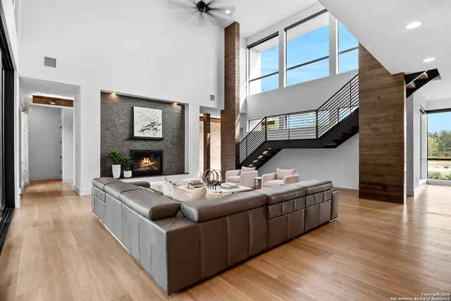 a kitchen with stainless steel appliances granite countertop a sink stove and wooden floor