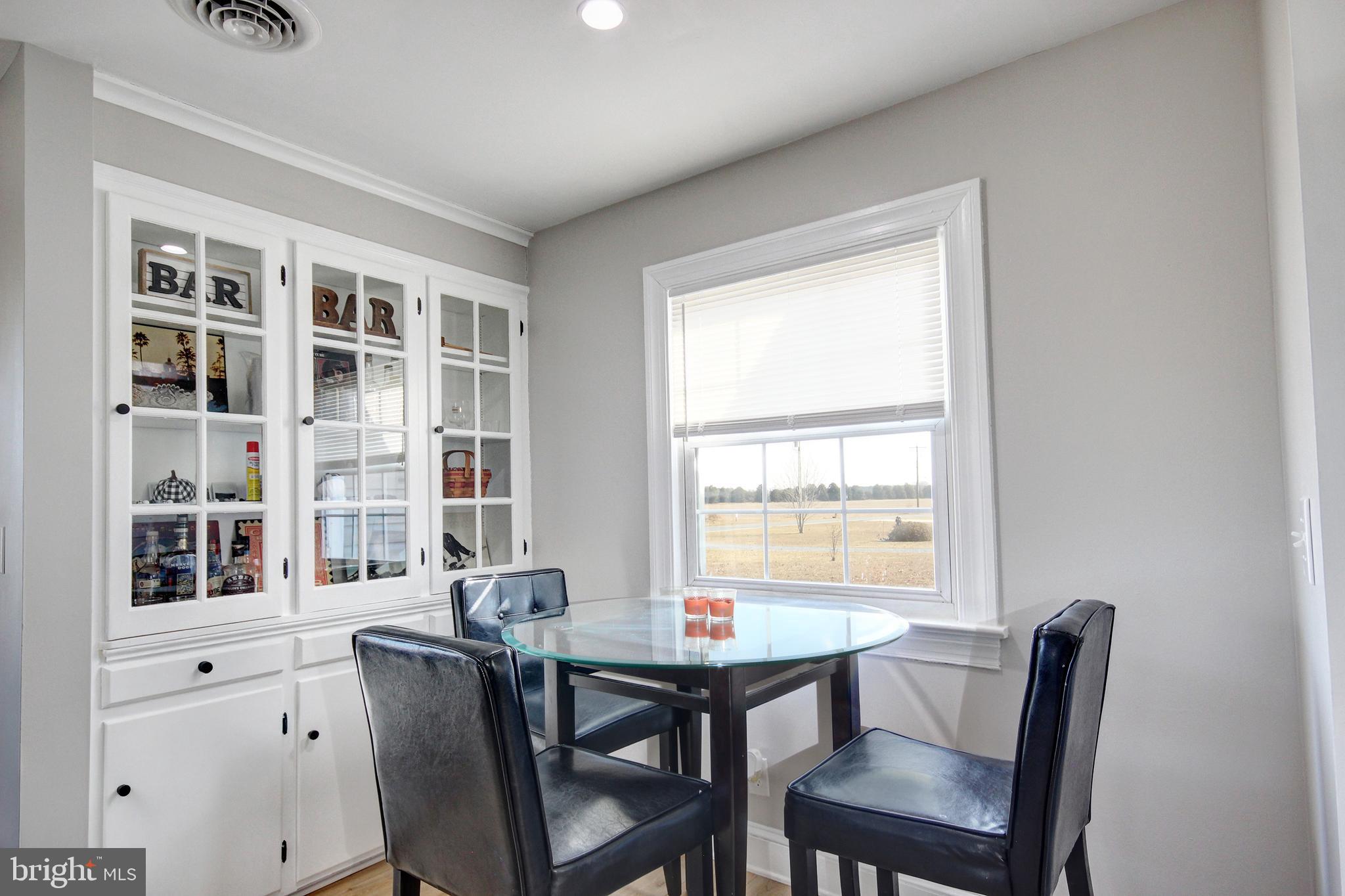 26177 Rewastico Road Hebron, MD 21830 - Photo 11 of 20 a view of a dining room with furniture and window