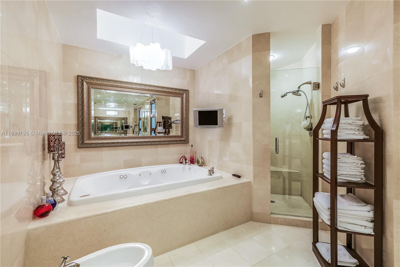 20155 Northeast 38th Court, Unit 2903 Aventura, FL 33180 - Photo 18 of 28 a bathroom with a tub and a sink