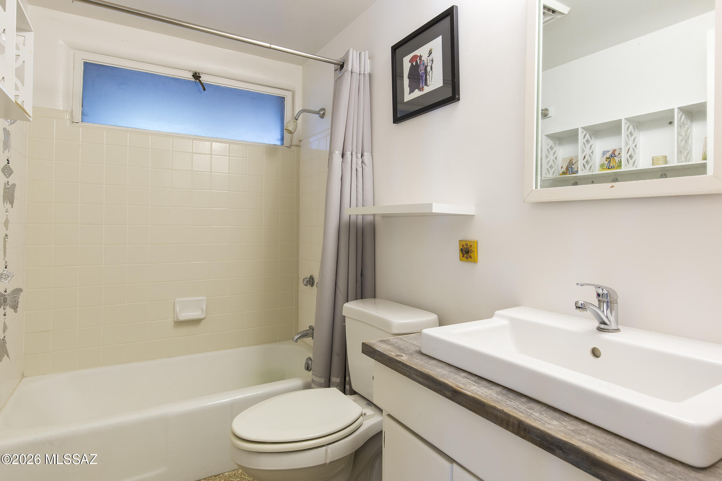 4130 East River Road Tucson, AZ 85718 - Photo 19 of 46 a bathroom with a sink a toilet and shower