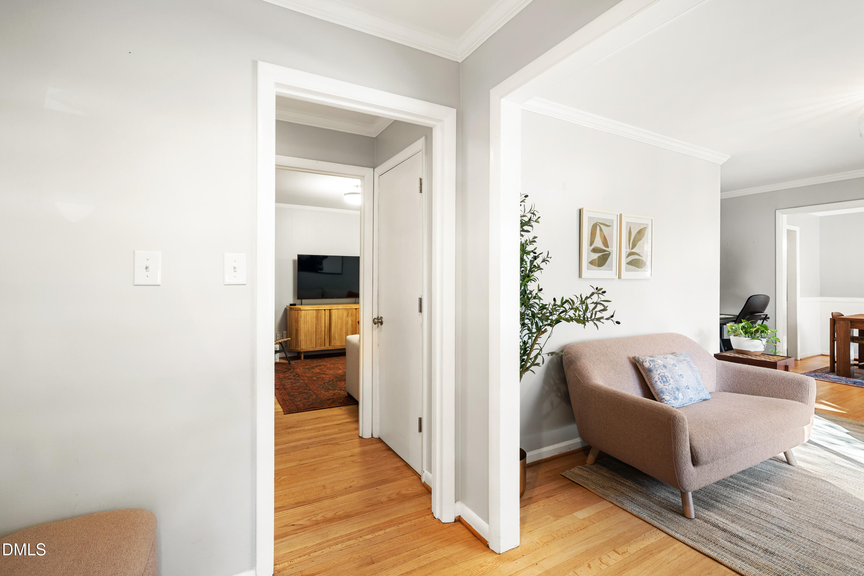 1801 Fountain Ridge Road Chapel Hill, NC 27517 - Photo 12 of 50 a hallway with couches and a potted plant with wooden floor