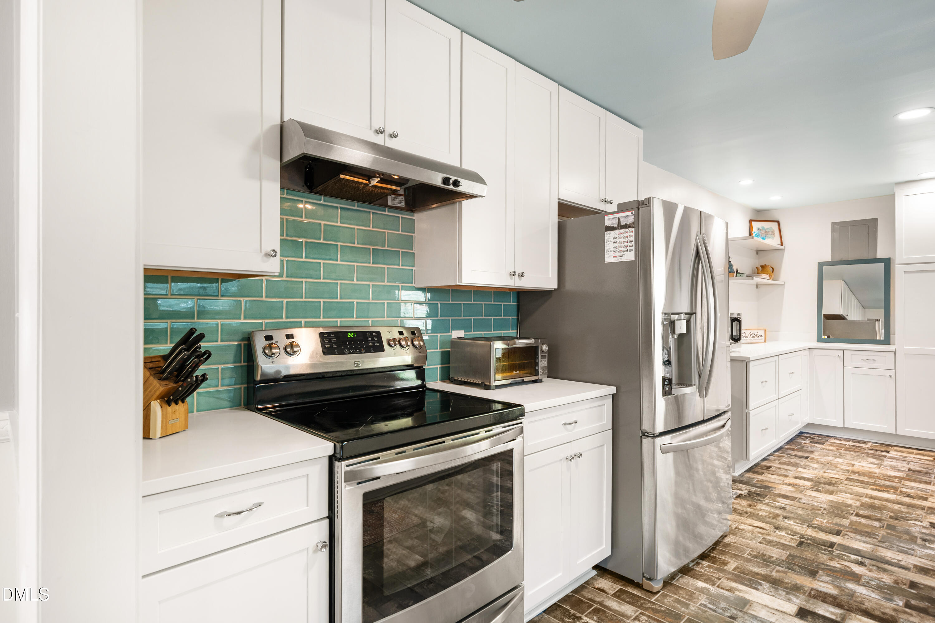 1801 Fountain Ridge Road Chapel Hill, NC 27517 - Photo 17 of 50 a kitchen with a refrigerator stove and cabinets