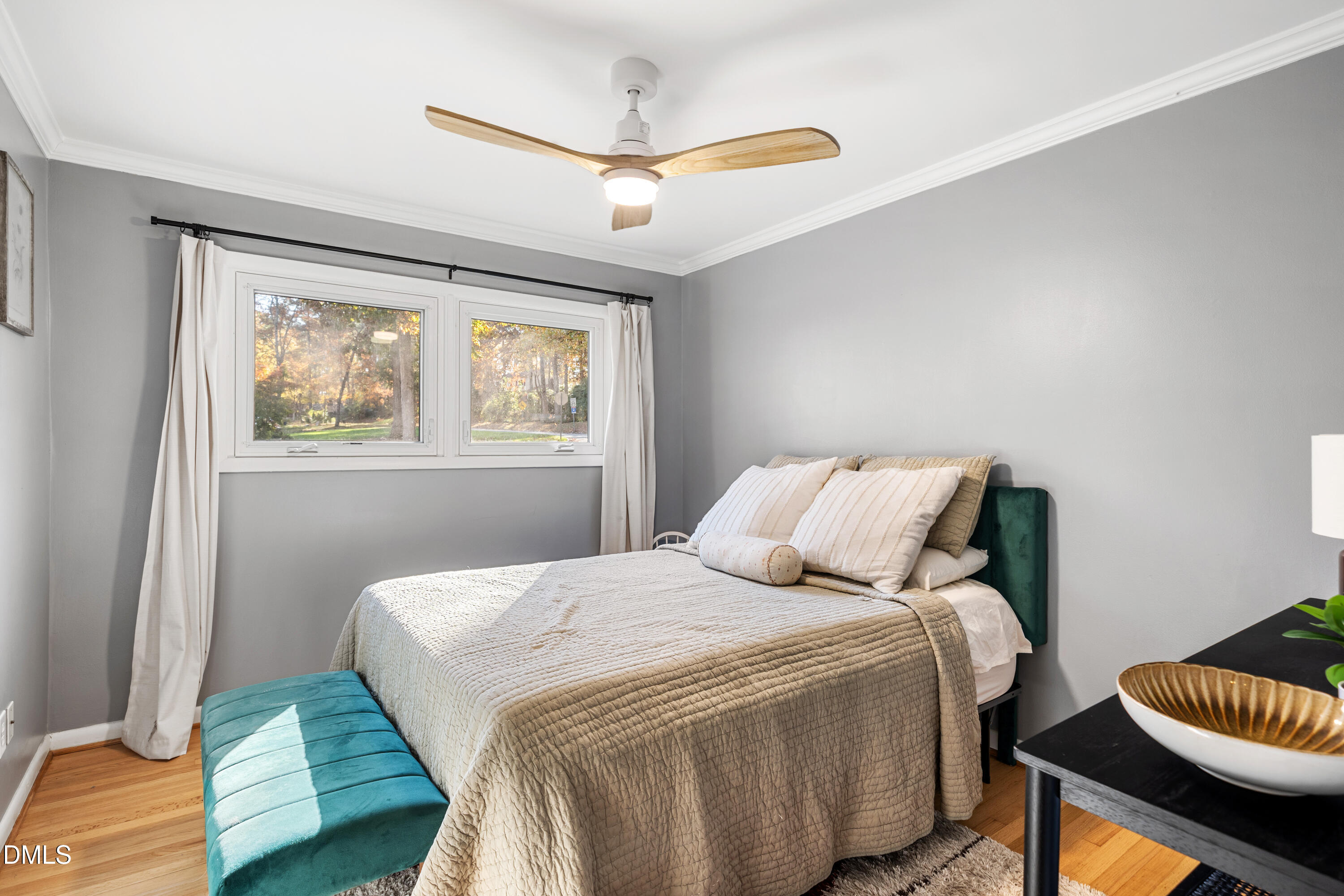 1801 Fountain Ridge Road Chapel Hill, NC 27517 - Photo 23 of 50 a bedroom with a bed and wooden floor