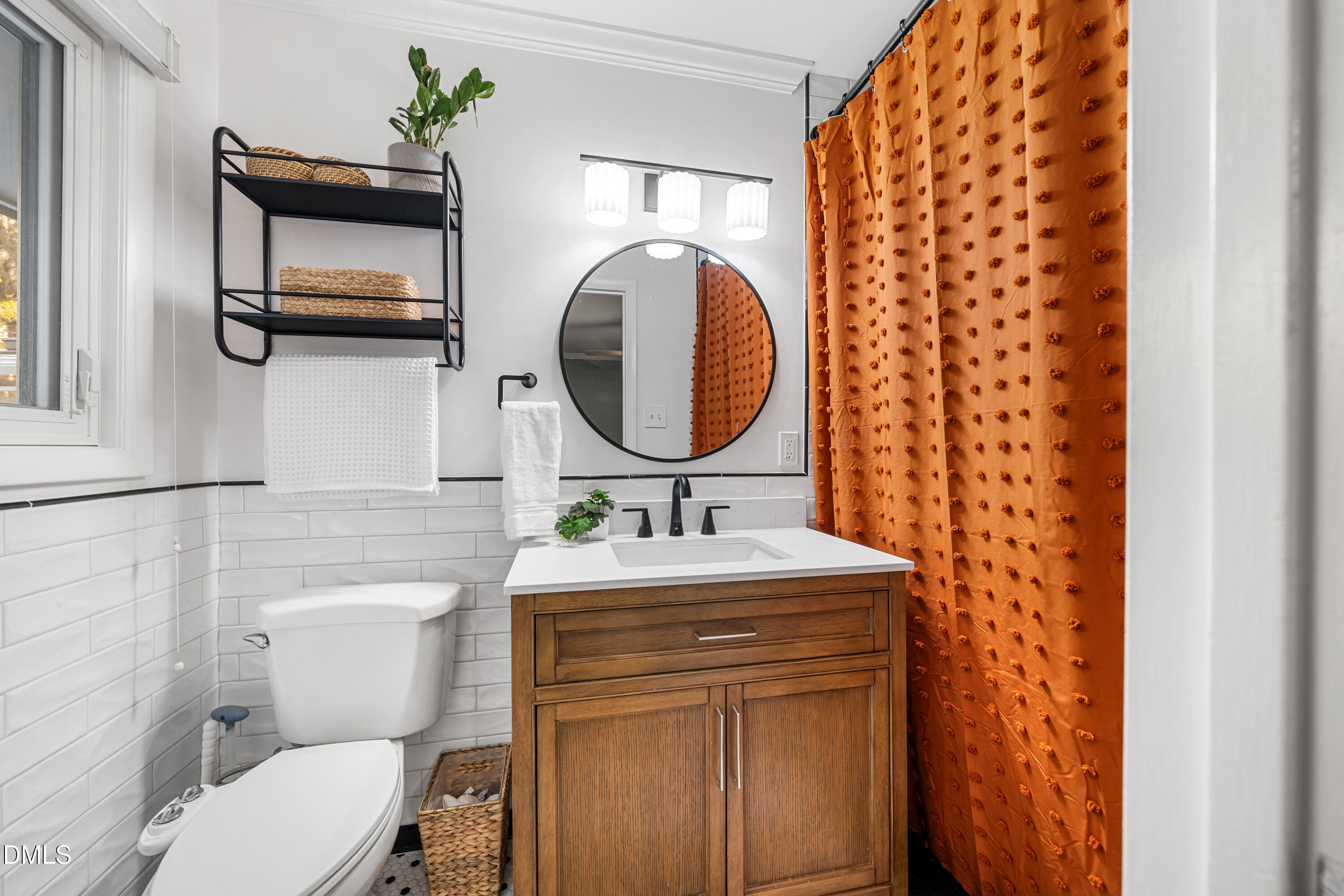 1801 Fountain Ridge Road Chapel Hill, NC 27517 - Photo 24 of 50 a bathroom with a toilet sink and mirror