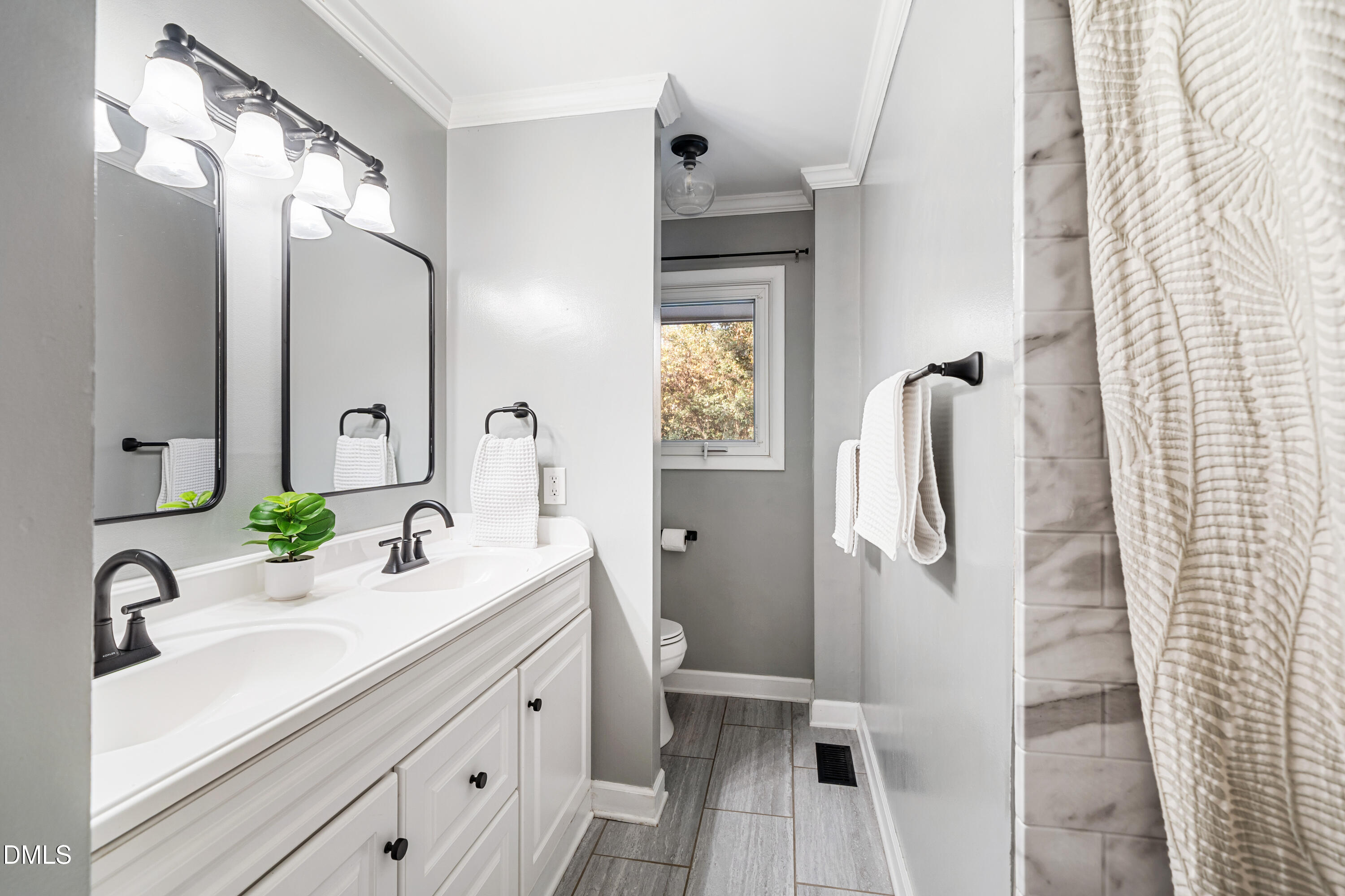 1801 Fountain Ridge Road Chapel Hill, NC 27517 - Photo 27 of 50 a bathroom with a double vanity sink mirror and toilet
