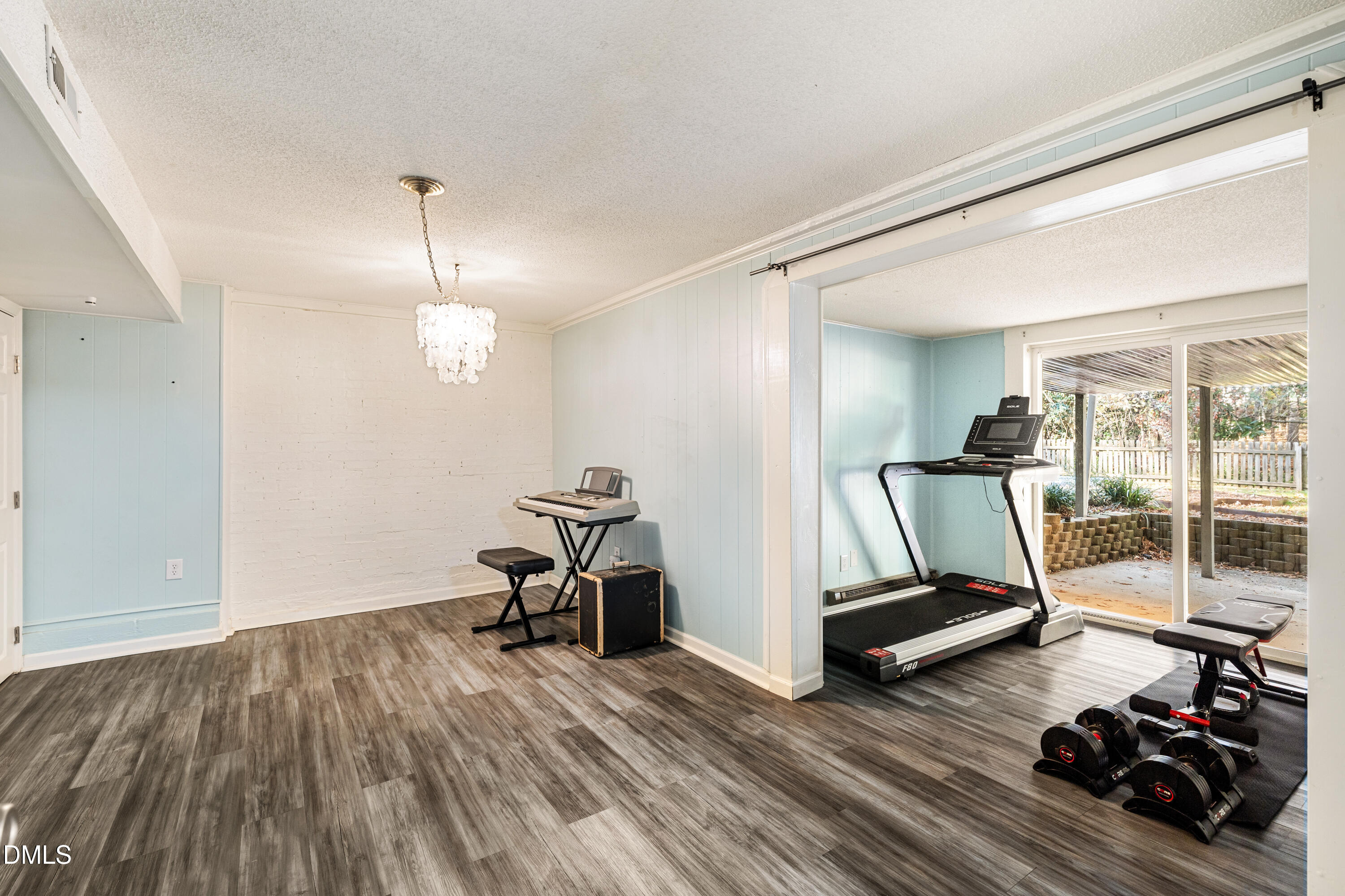 1801 Fountain Ridge Road Chapel Hill, NC 27517 - Photo 31 of 50 a view of a room with wooden floor and gym equipment
