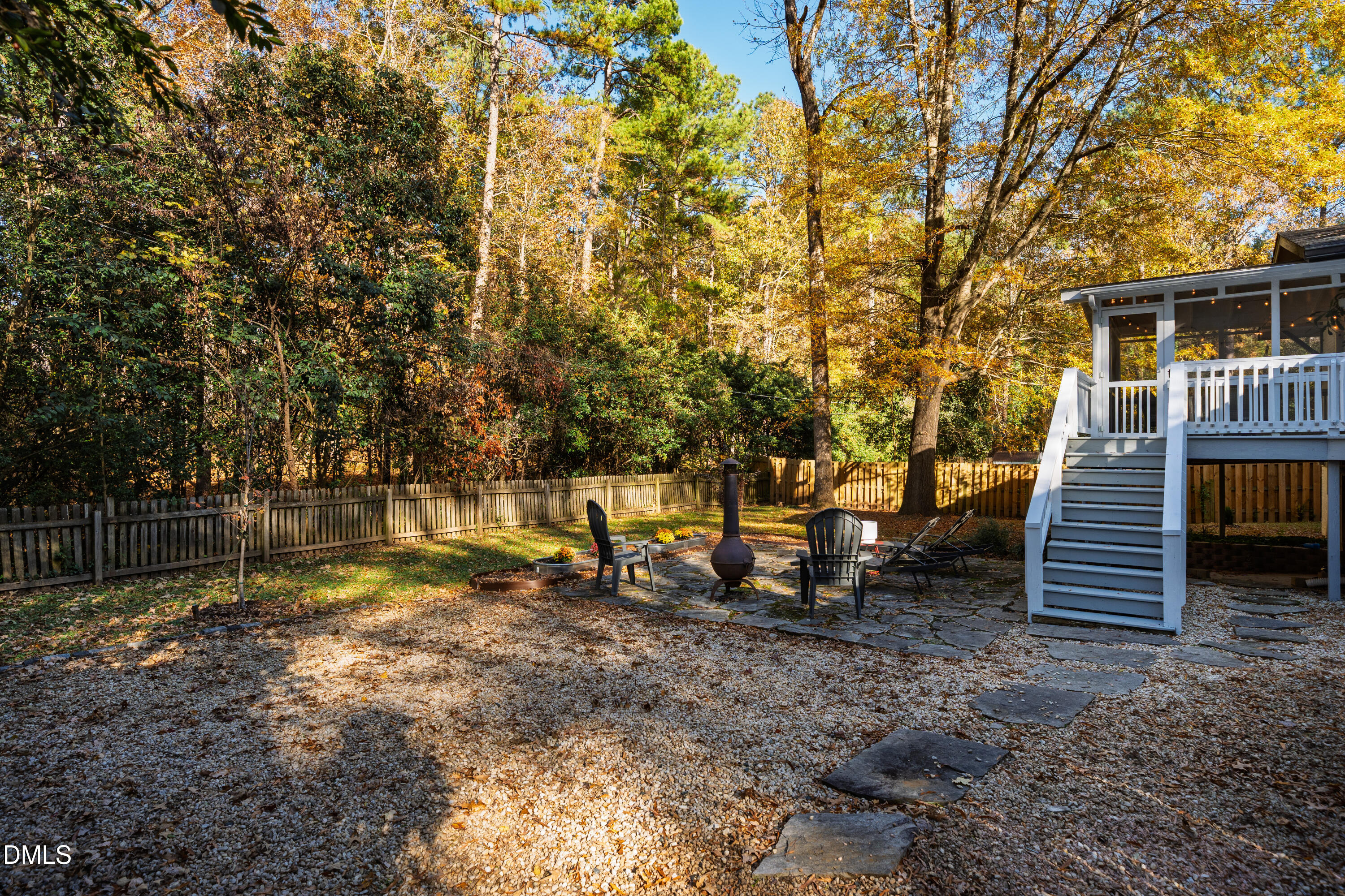 1801 Fountain Ridge Road Chapel Hill, NC 27517 - Photo 38 of 50 a backyard of a house with table and chairs