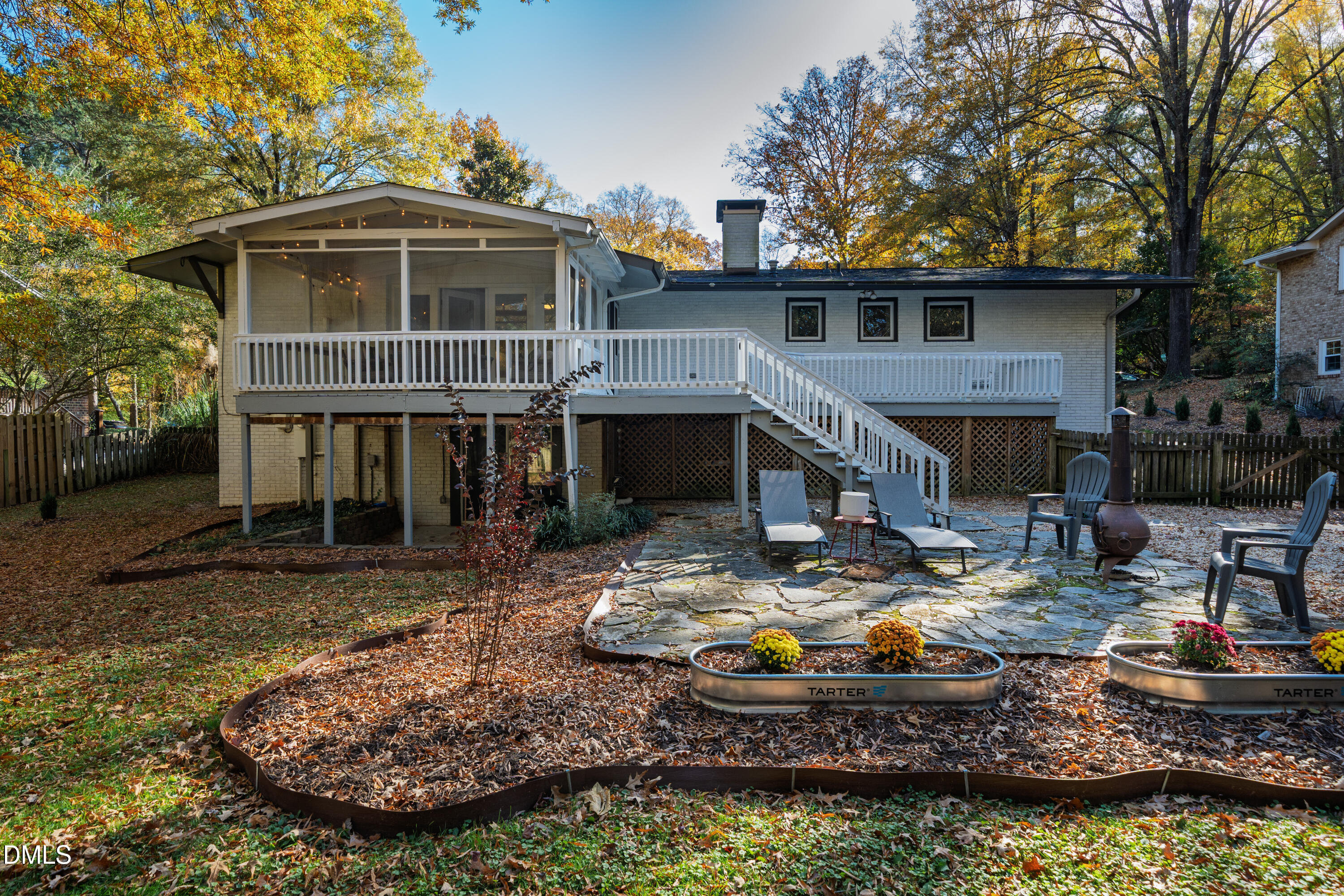 1801 Fountain Ridge Road Chapel Hill, NC 27517 - Photo 3 of 50 a front view of a house with a yard fire pit and outdoor seating