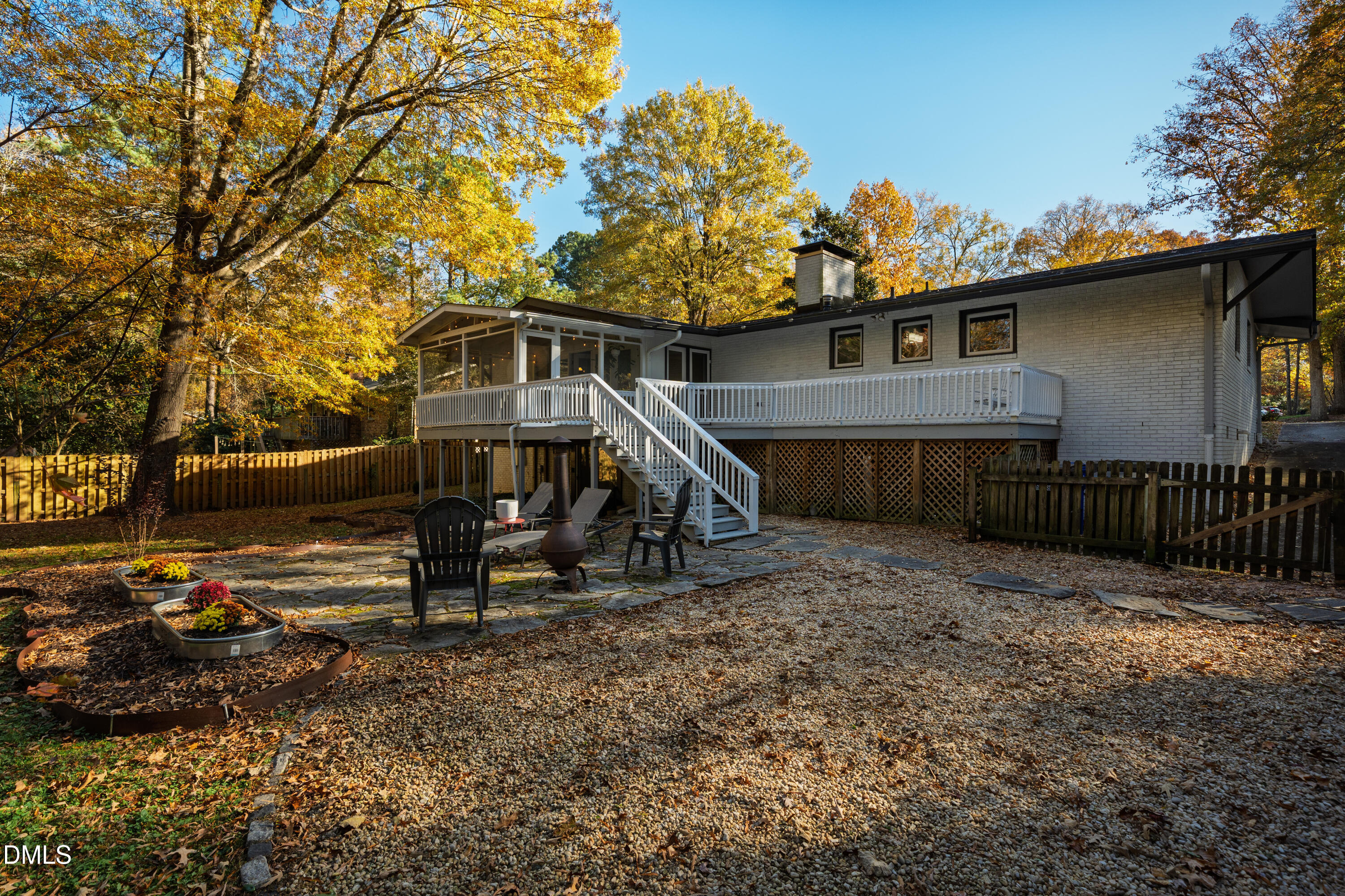1801 Fountain Ridge Road Chapel Hill, NC 27517 - Photo 46 of 50 a view of a house with a wooden deck and a backyard