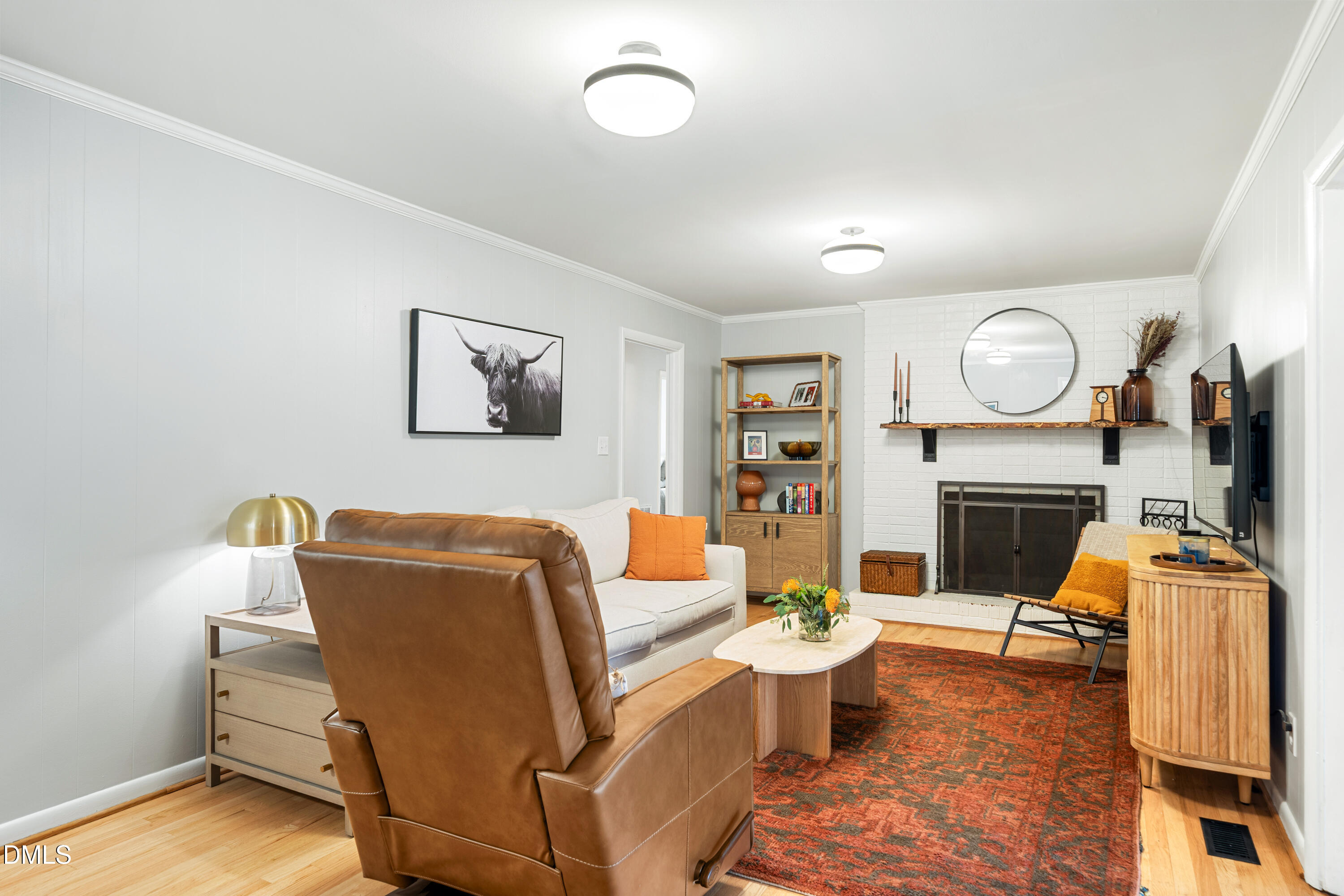 1801 Fountain Ridge Road Chapel Hill, NC 27517 - Photo 9 of 50 a living room with furniture and a fireplace