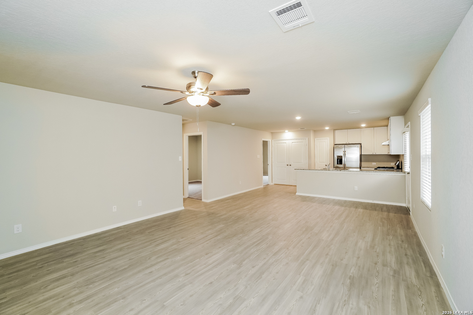 9115 Griffith Converse, TX 78109 - Photo 3 of 15 a view of a kitchen with wooden floor and a kitchen