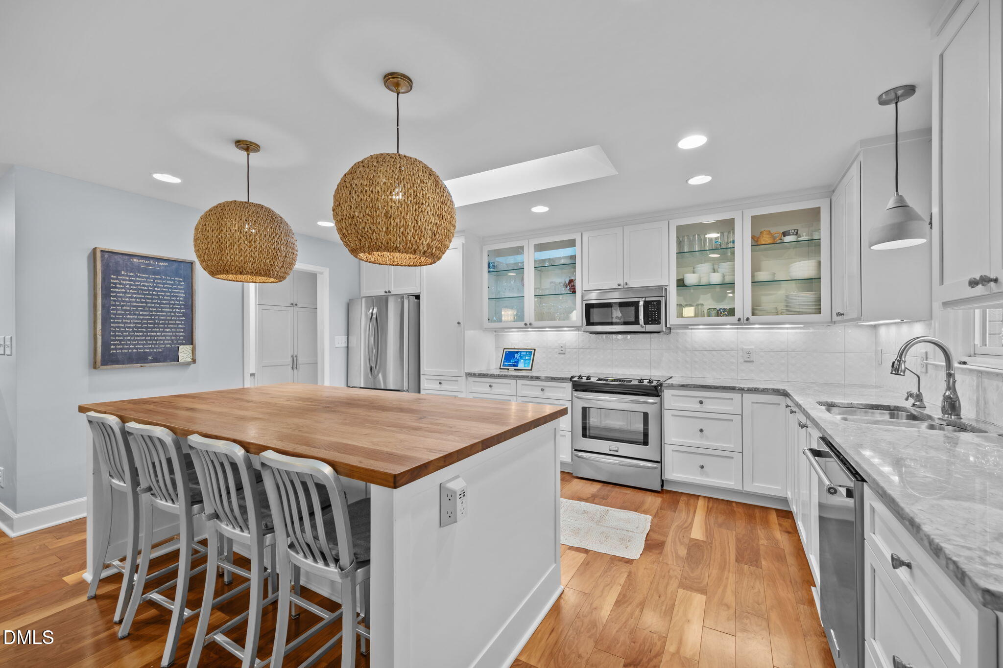 1812 Rolling Road Chapel Hill, NC 27514 - Photo 10 of 72 a kitchen with stainless steel appliances granite countertop a stove a sink a oven a dining table and chairs