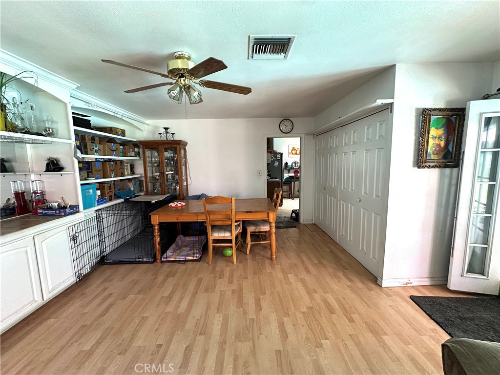 24 South Ash Street Redlands, CA 92373 - Photo 14 of 18 a dining room with furniture and wooden floor
