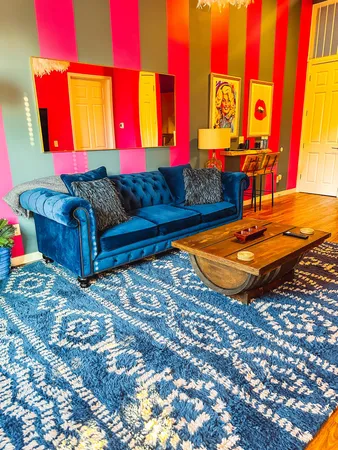 a living room with furniture and a rug