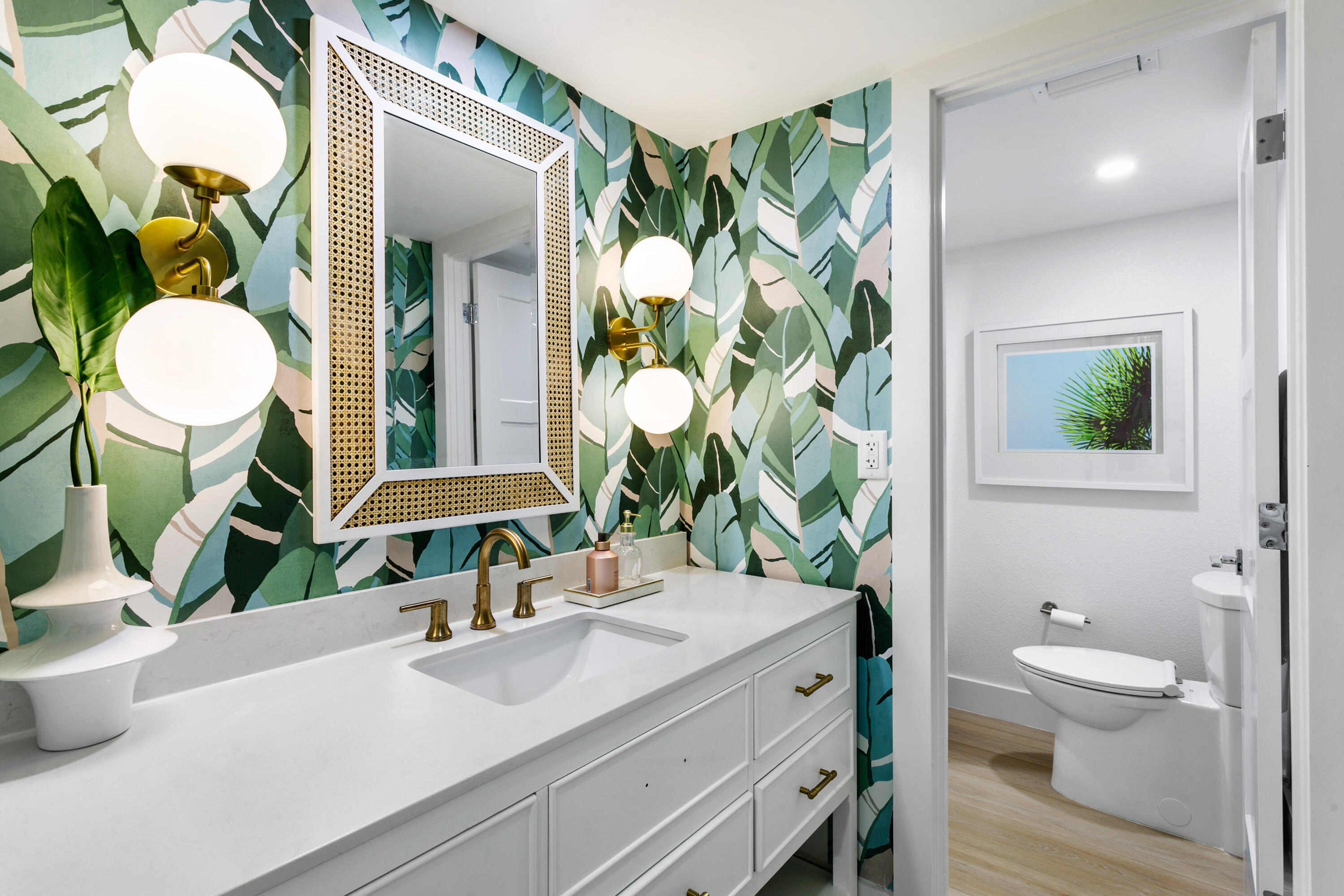 100 Ocean Trail Way, Unit 910 Jupiter, FL 33477 - Photo 18 of 30 a bathroom with a granite countertop sink mirror vanity and toilet