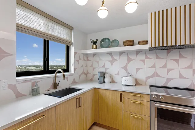 a kitchen with a sink and cabinets