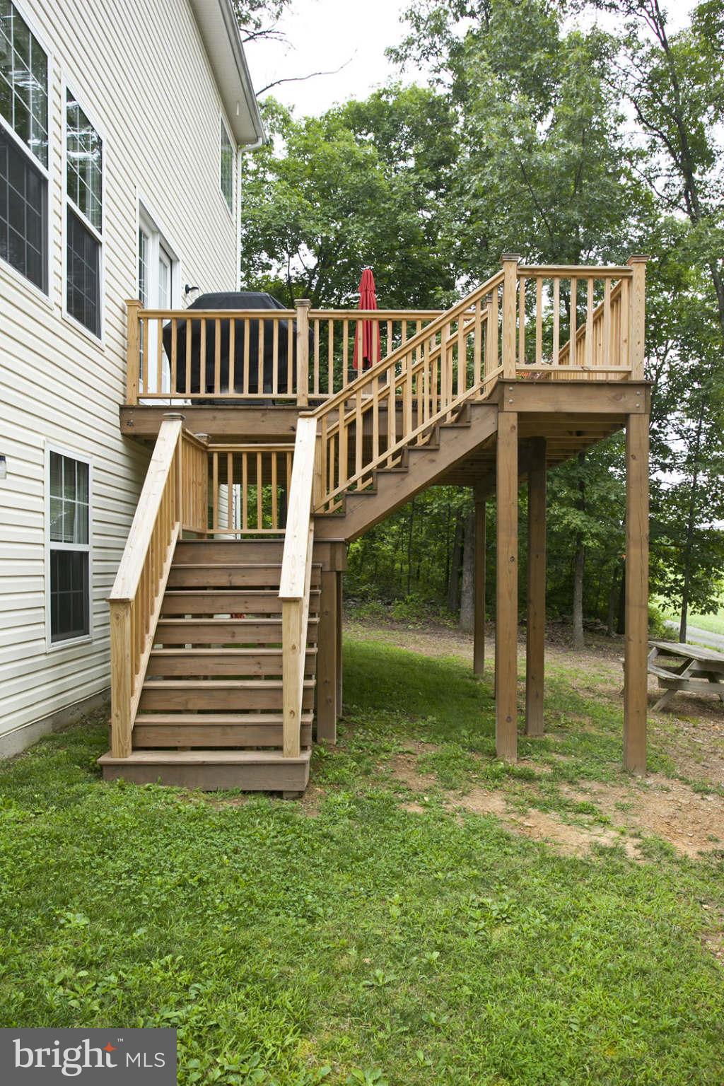 131 Holiday Road Cross Junction, VA 22625 - Photo 29 of 30 a view of a house with a yard and deck